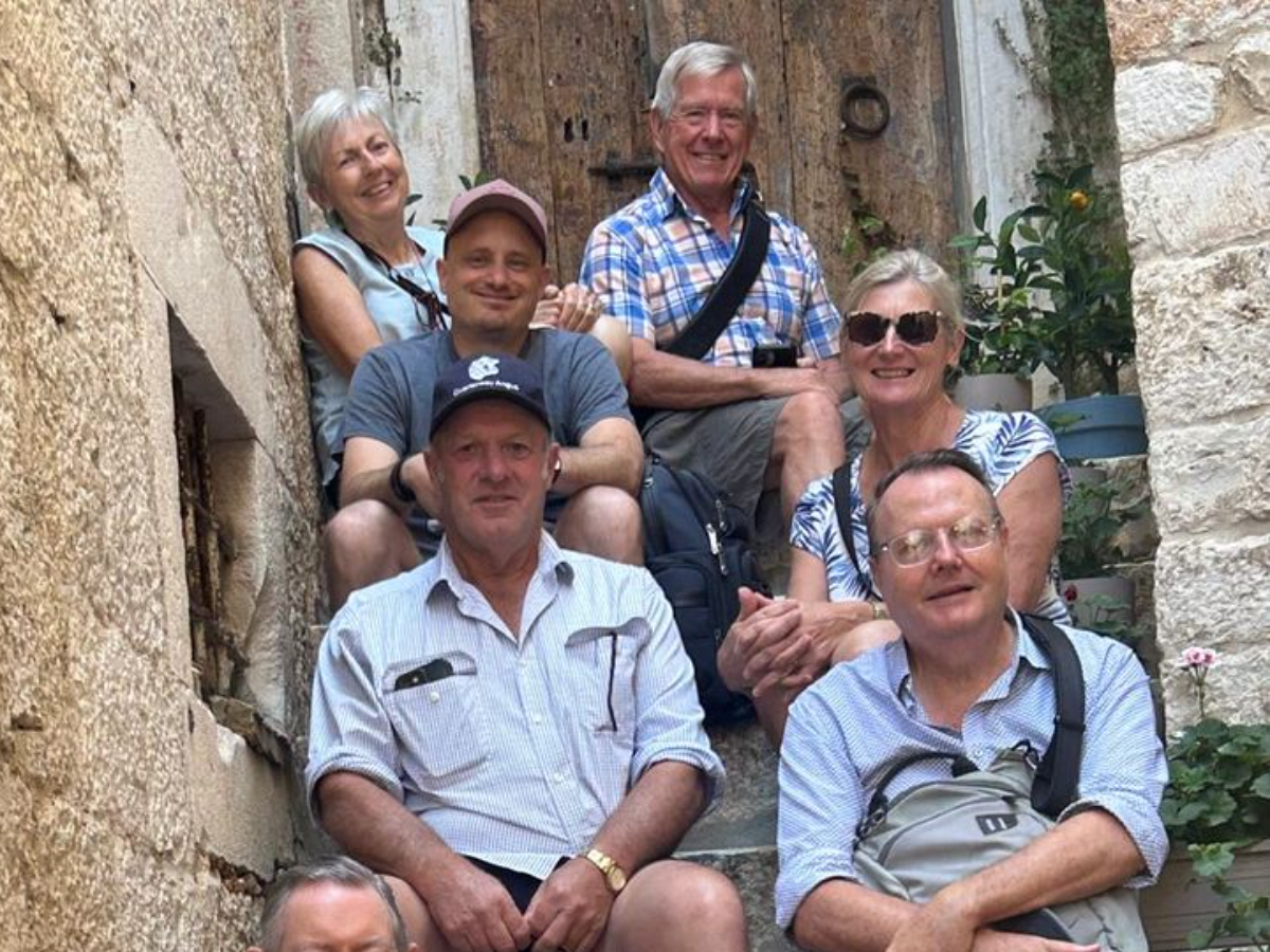 With a group on the old-town steps, Dalmatia